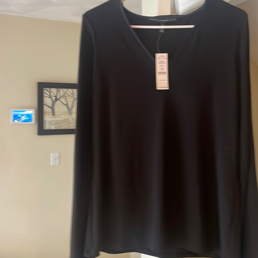 Beautiful bat wing flowing black blouse. Perfect for the holidays! Never worn!